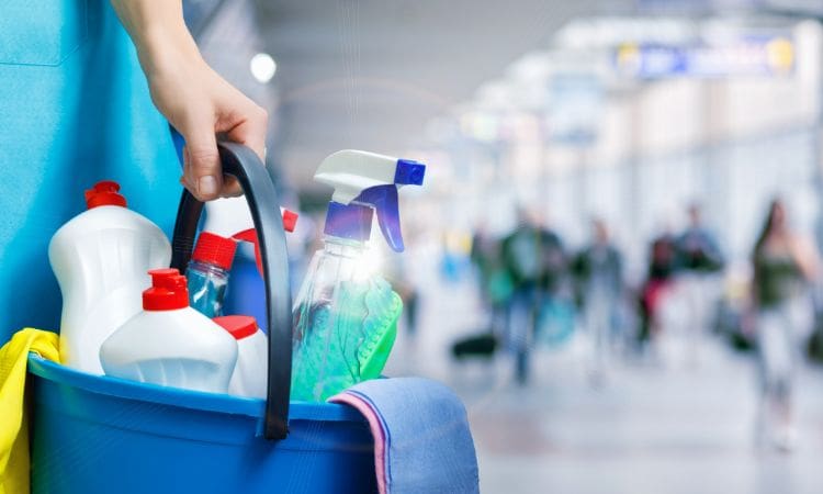 Person holding commercial cleaning products - Unique Cleaning Group