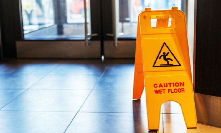 Wet floor sign - Unique Cleaning Group