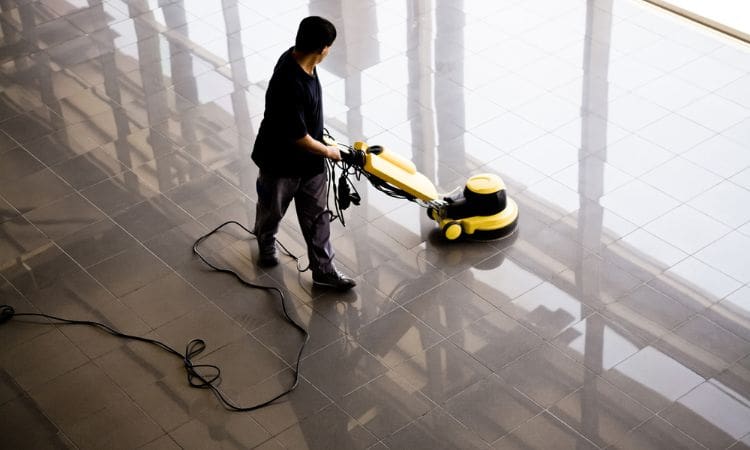 Person doing a commercial cleaning - Unique Cleaning Group